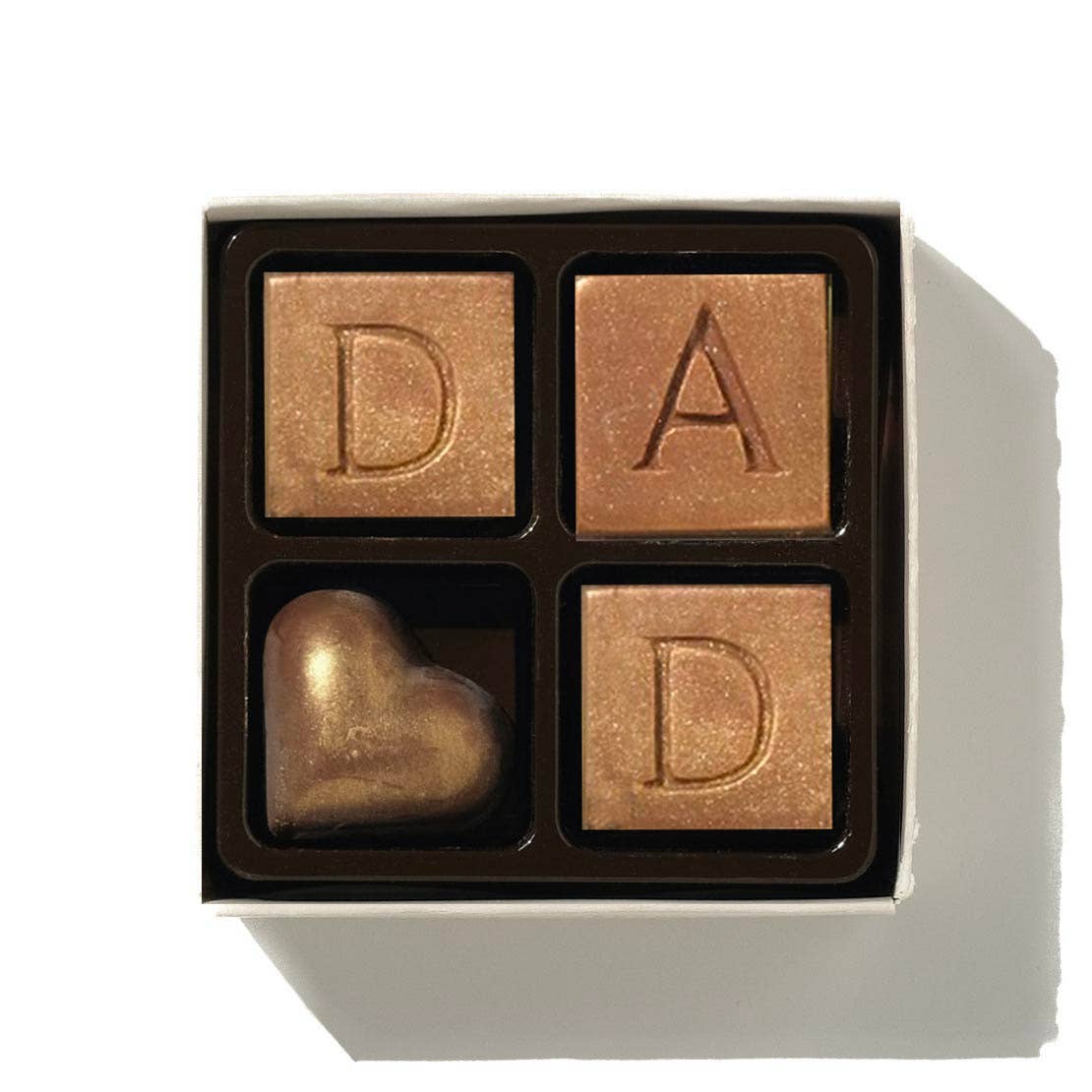 Dad cubes of Belgium chocolate with one gold dust heart.