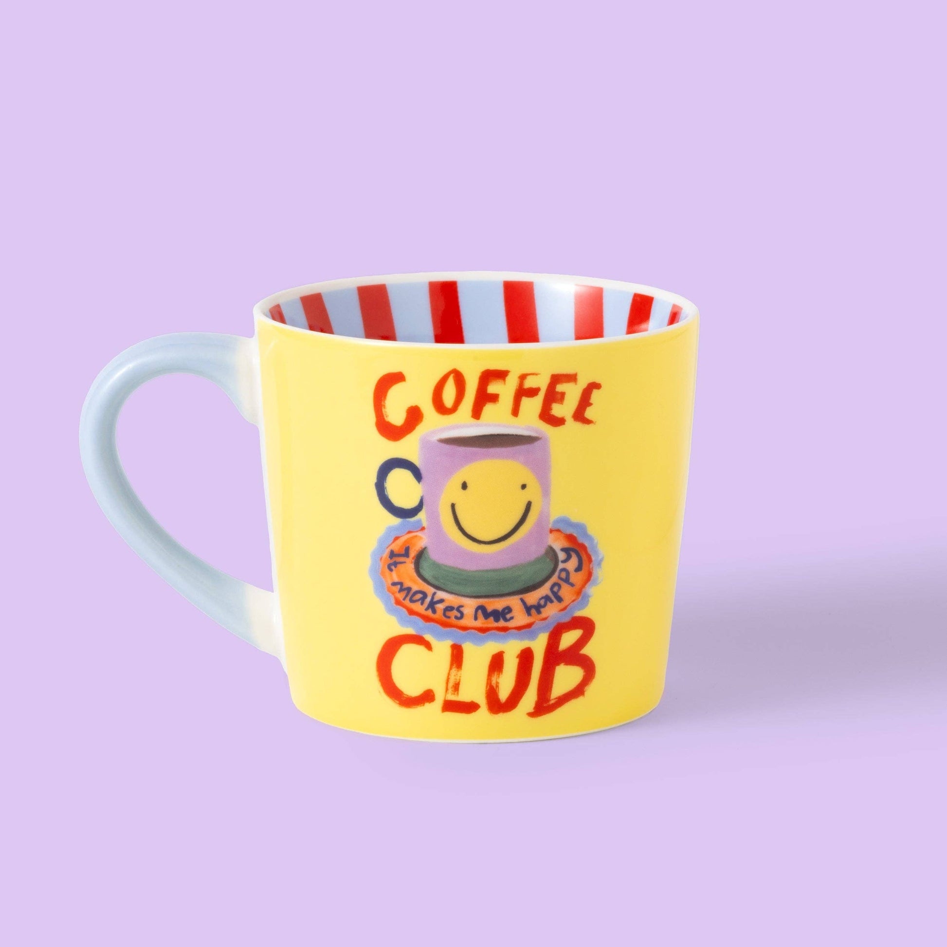 Yellow mug with a smiley face design and text on a purple background
