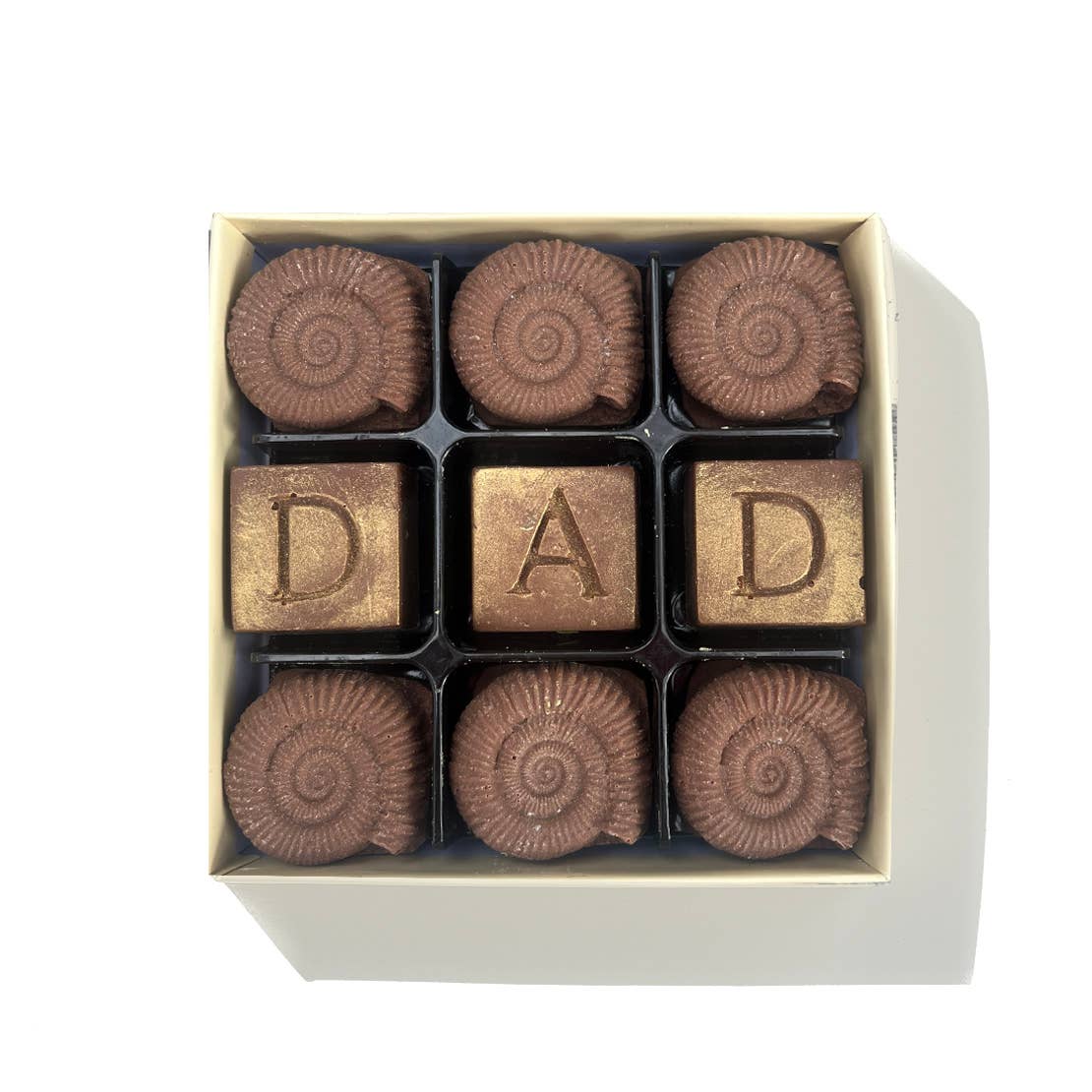 The finest Belgium chocolate shaped like fossils and square cubes with the word Dad embossed on the top.