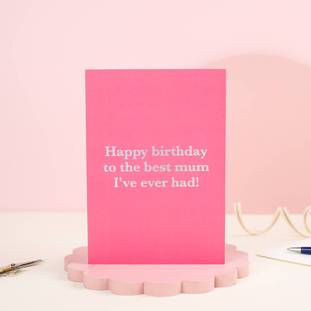 Bright pink card. Holographic text Happy Birthday to the best mum I've ever had.