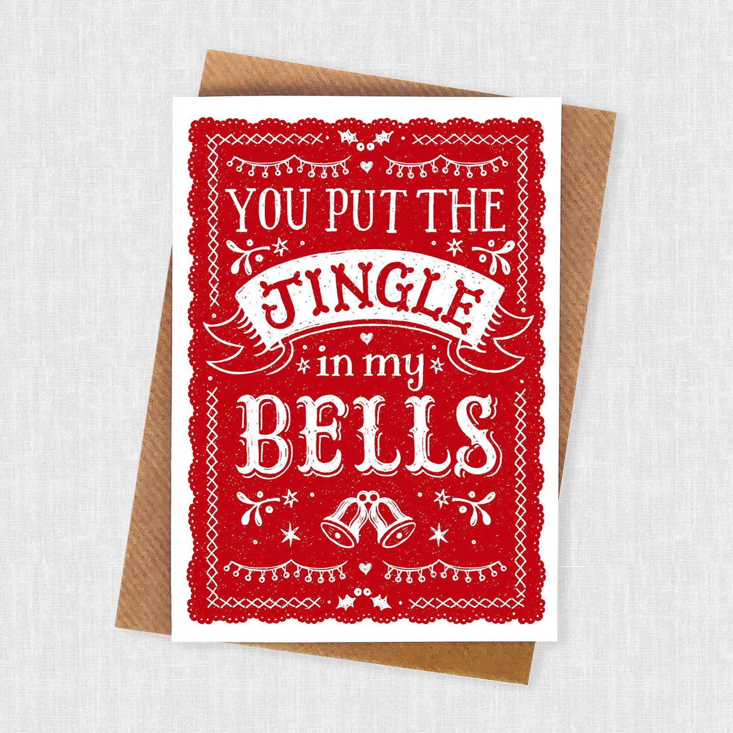 Christmas Card. Red with white lettering Text reads You put the Jingle in my bells.
