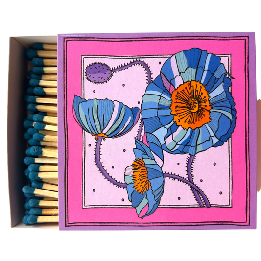 Matches in a beautifully illustrated blue box with blue poppies and a pink background.