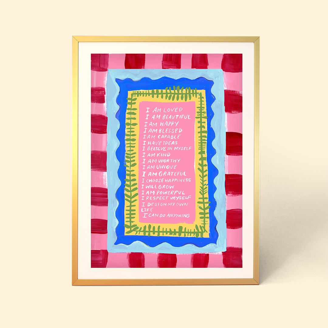 Framed artwork with colorful text on a pink and red striped background