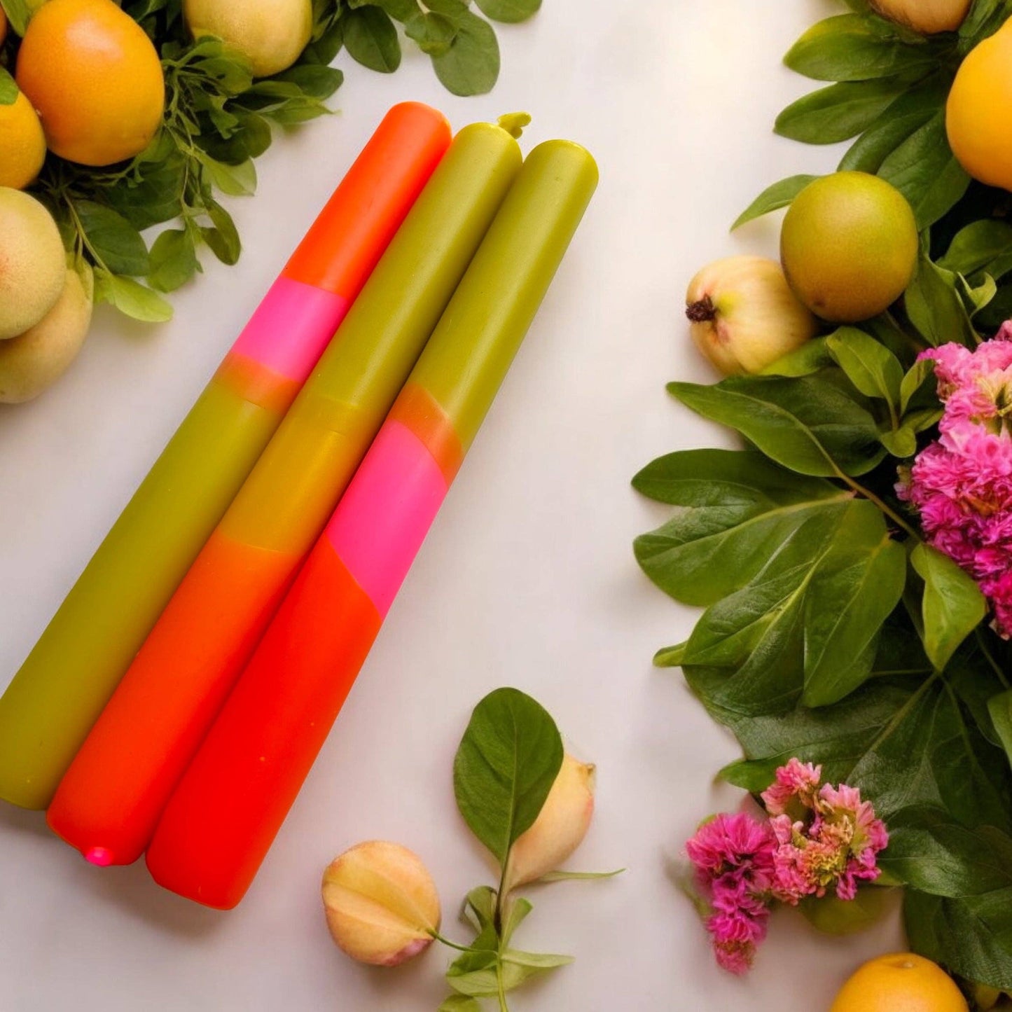 Trio of dinner candles. 70s inspired colours, olive green, orange and pink.