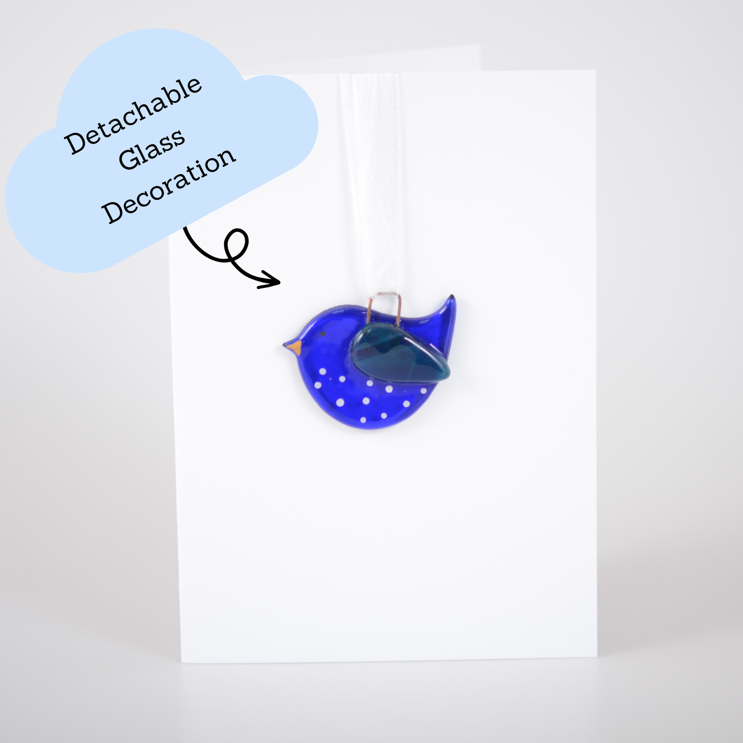 Blue glass decoration with a detachable glass piece on a white background
