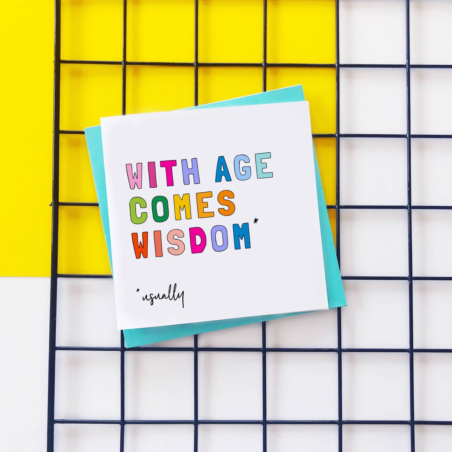 Colourful text card reading With age comes wisdom usually