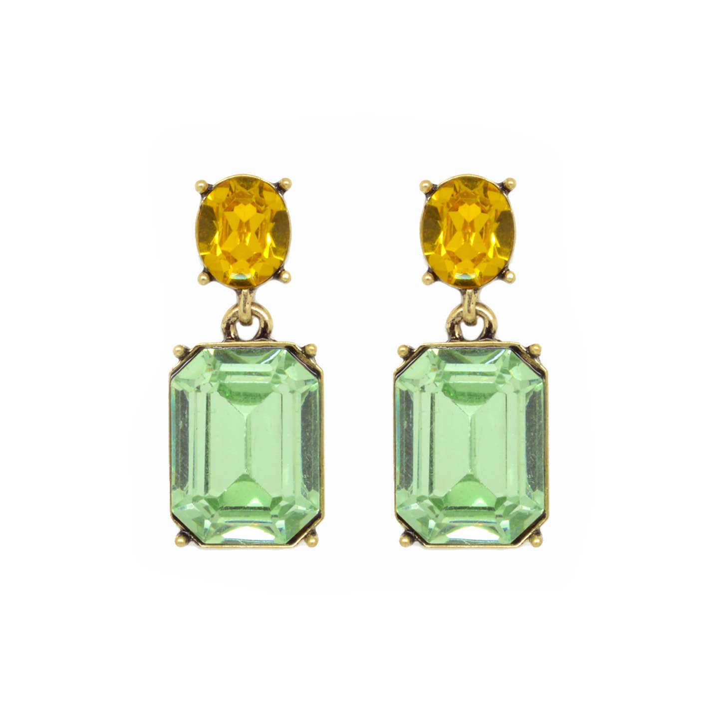 Pair of earrings with yellow and green gemstones on a white background