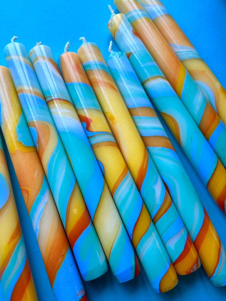 marbled dinner candles, blues and yellows.