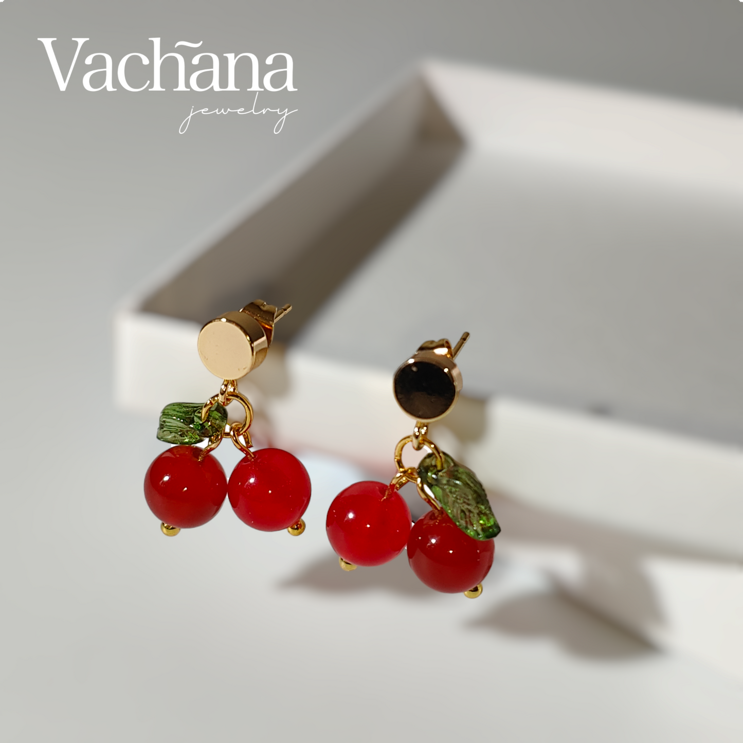 red ruby gem stone on gold plated stud.