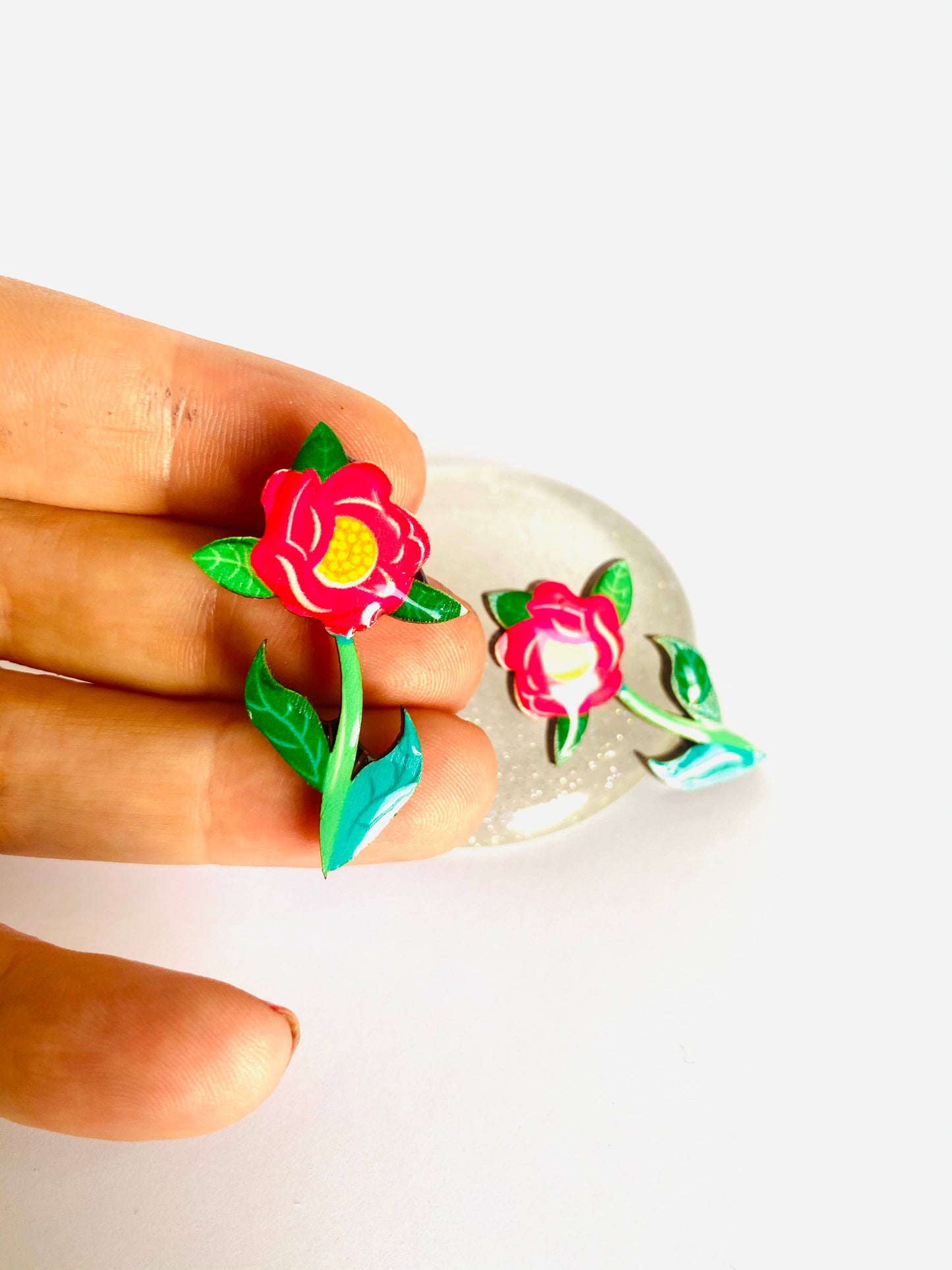 Resin and wooden flower earrings with stem.