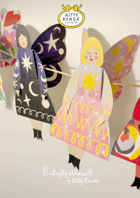 Colorful paper dolls with butterfly wings and dresses, featuring the brand 'Kitty Kenda'.
