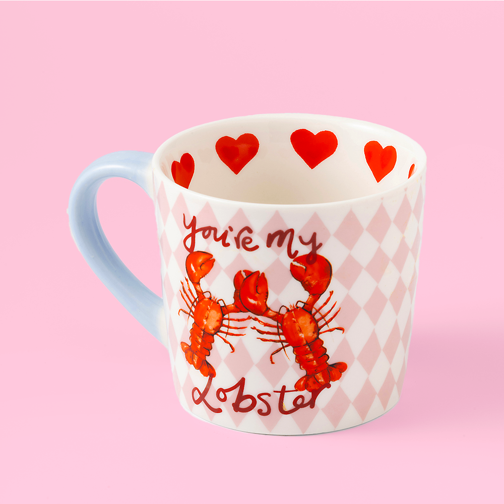 Mug with lobster design and 'Give me my lobster' text on a pink background