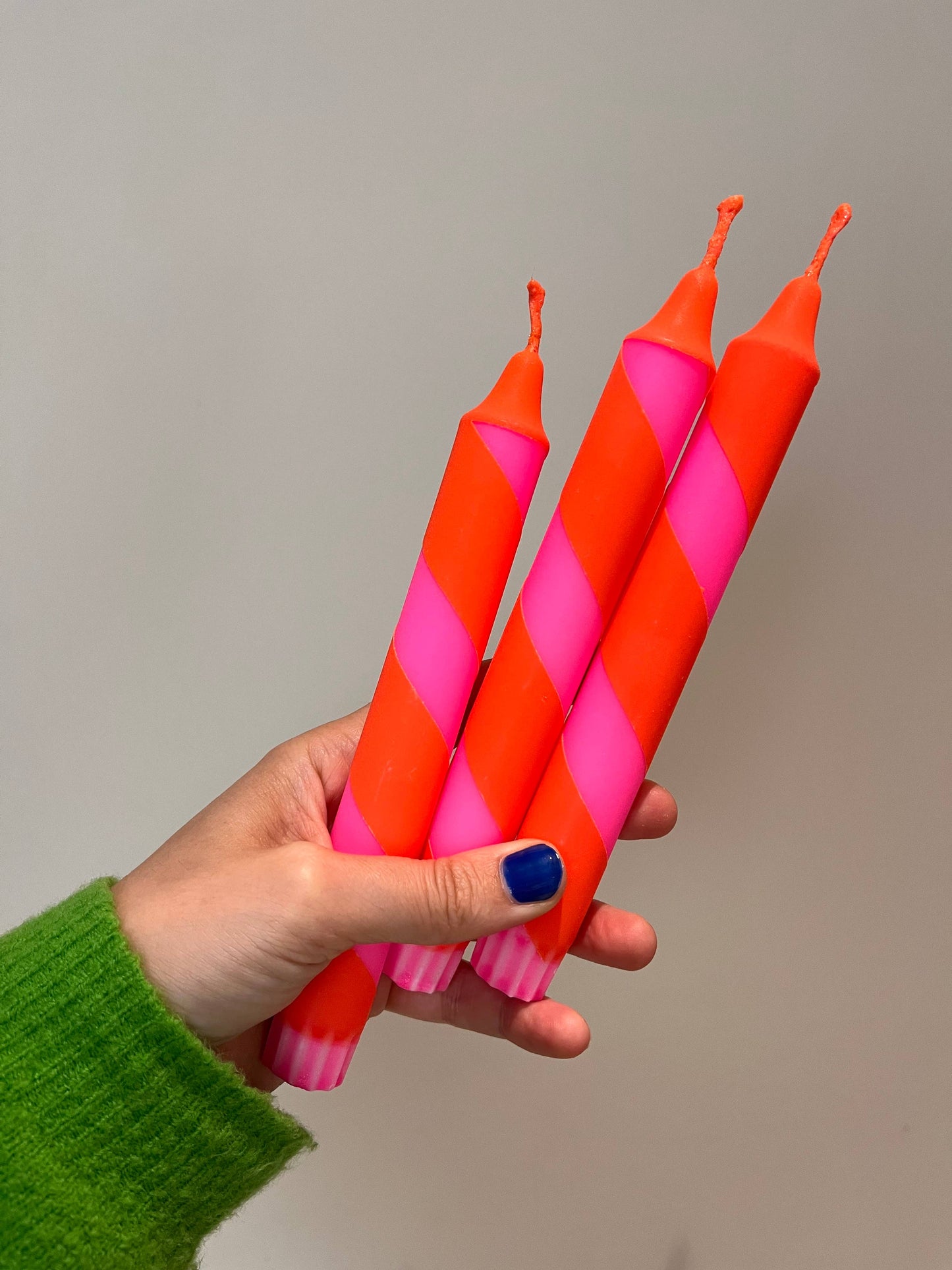 Neon pink and orange heater skelter table candle.