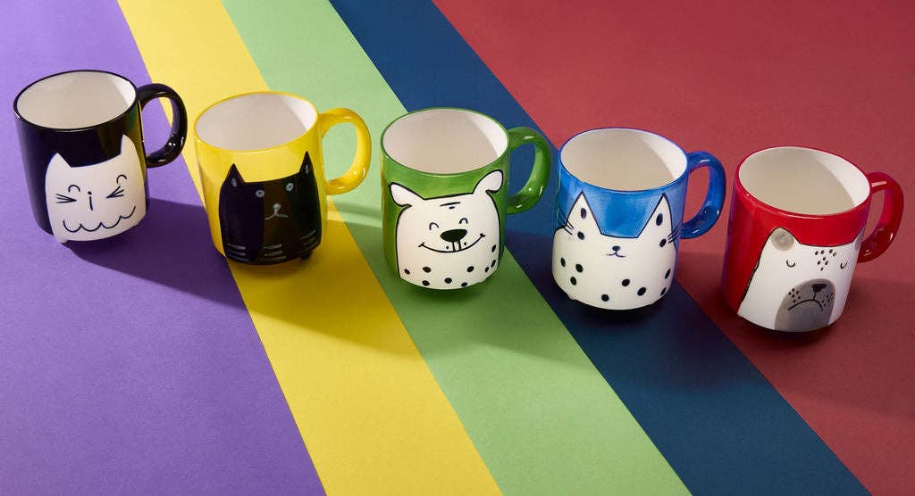 Set of colorful mugs with animal faces on a multicolored background