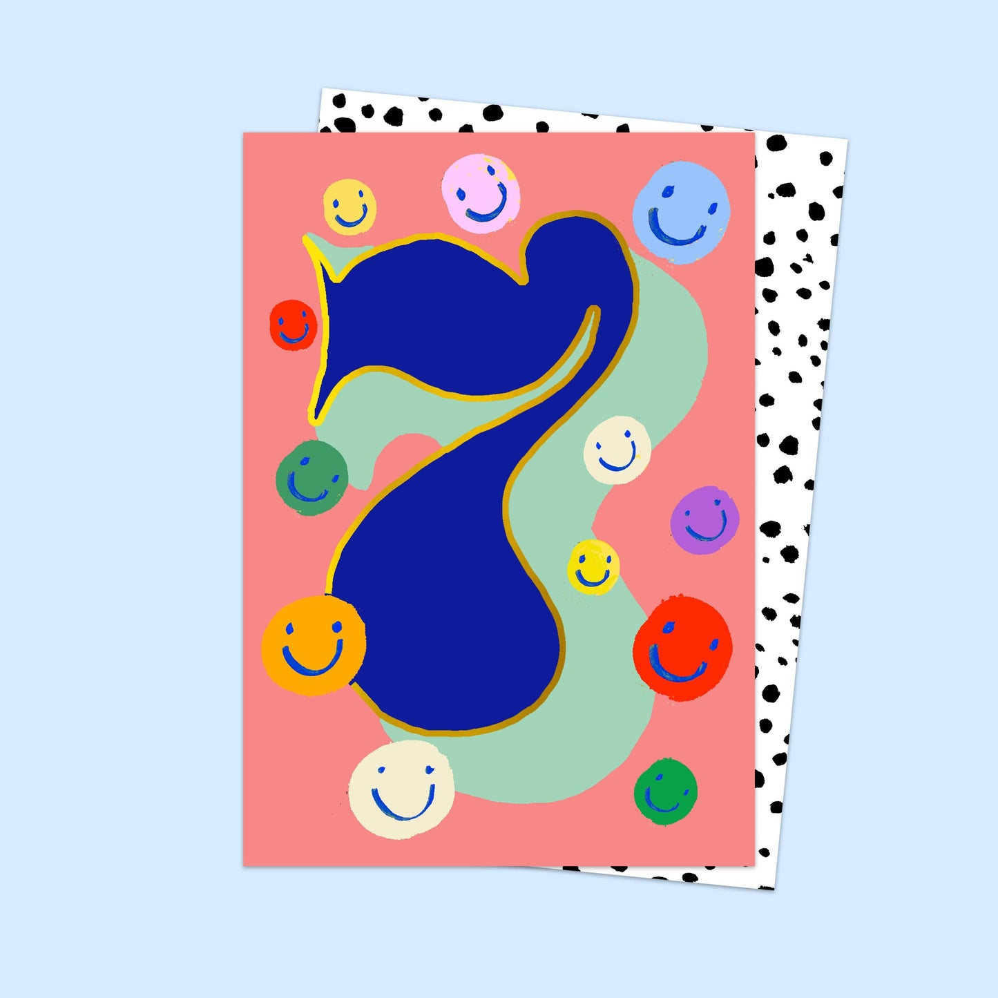 Colorful abstract design with smiley faces on a pink card against a light blue background