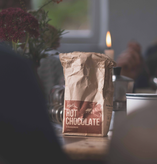 Bag of Härth Hot Chocolate on a table with blurred background