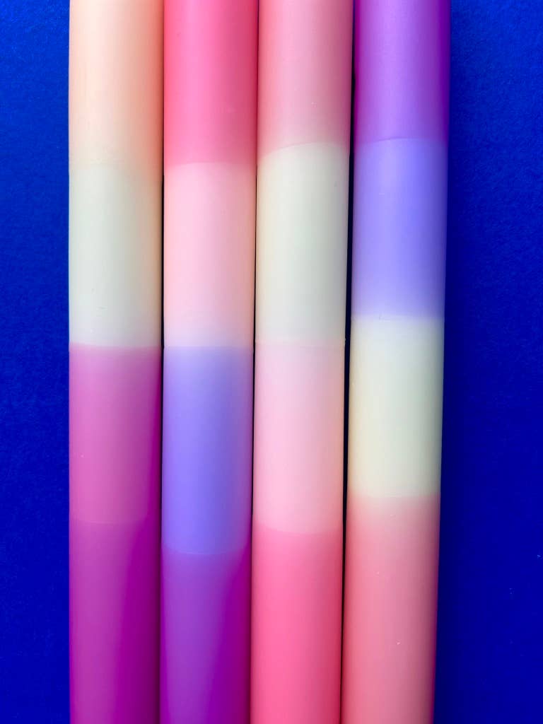 Set of 4 table candles. pastel colours of lemon yellow, peach, lilac and apricot.