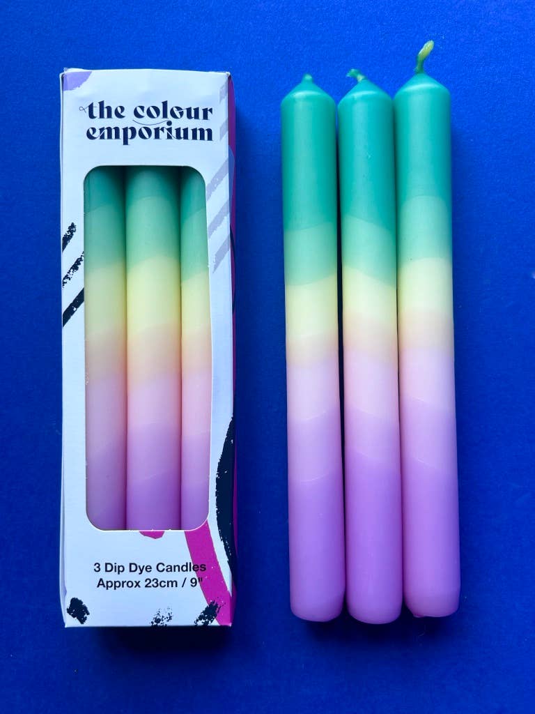 Set of 3 table candles. Colours pastel lilac moving through yellow topped with teal.