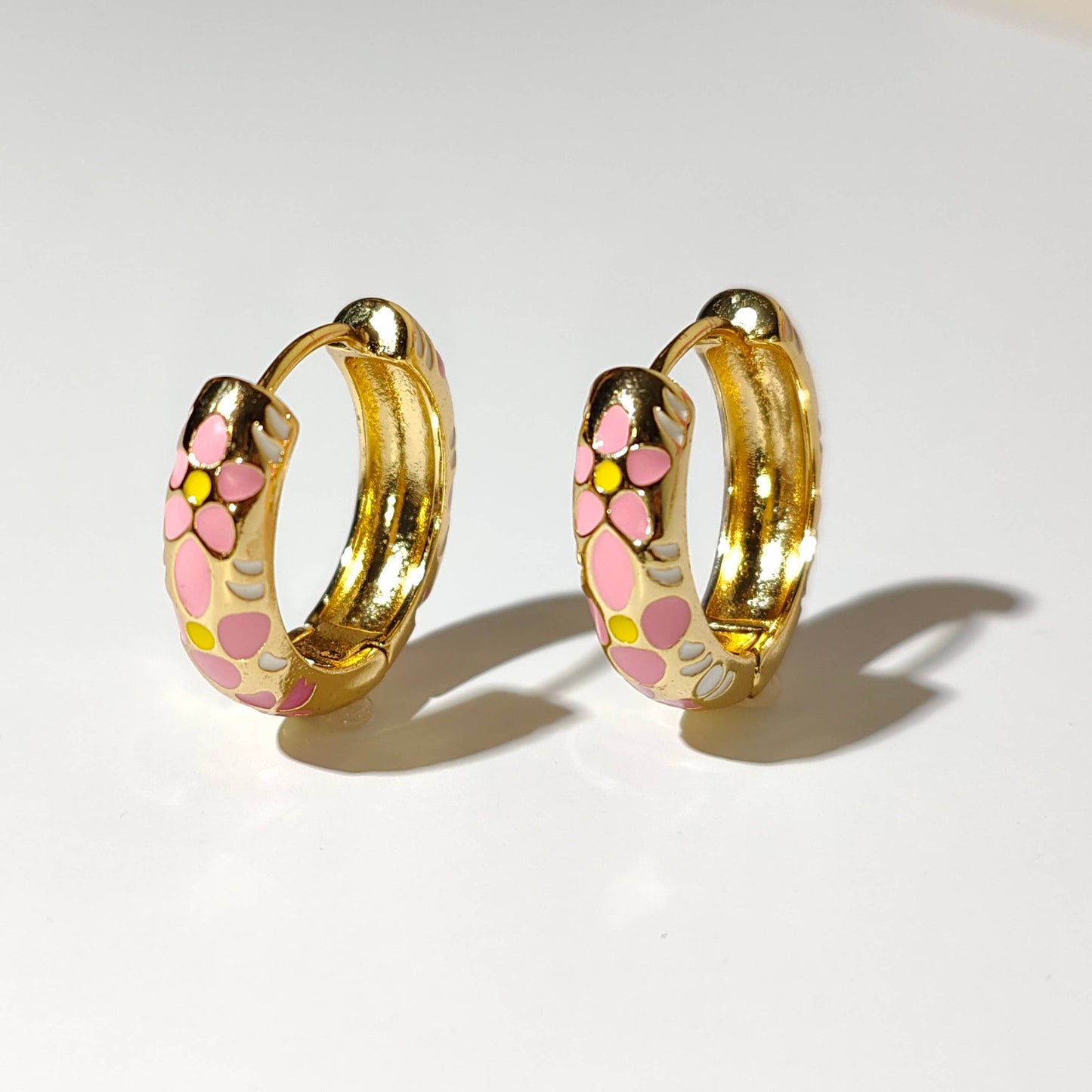 Flower Pastel gold plated hoop earrings.