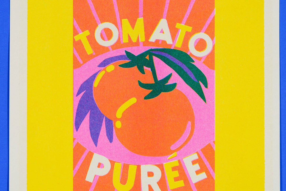 Colorful label for tomato puree with a tomato illustration on a striped background