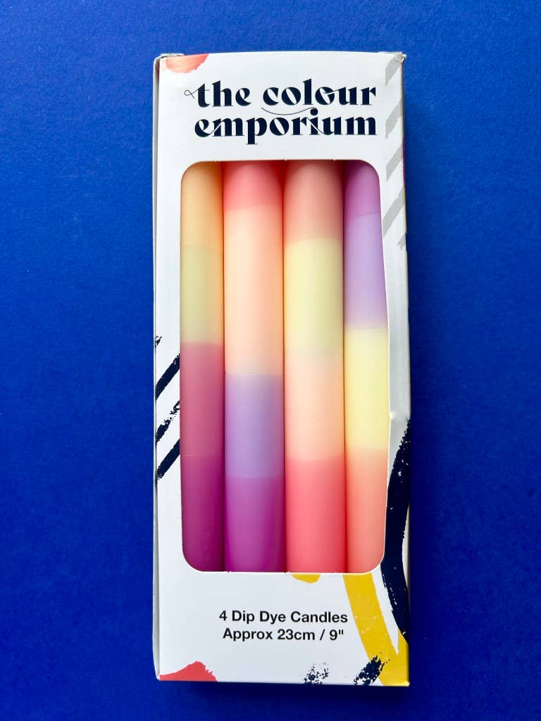 Set of 4 table candles. pastel colours of lemon yellow, peach, lilac and apricot.