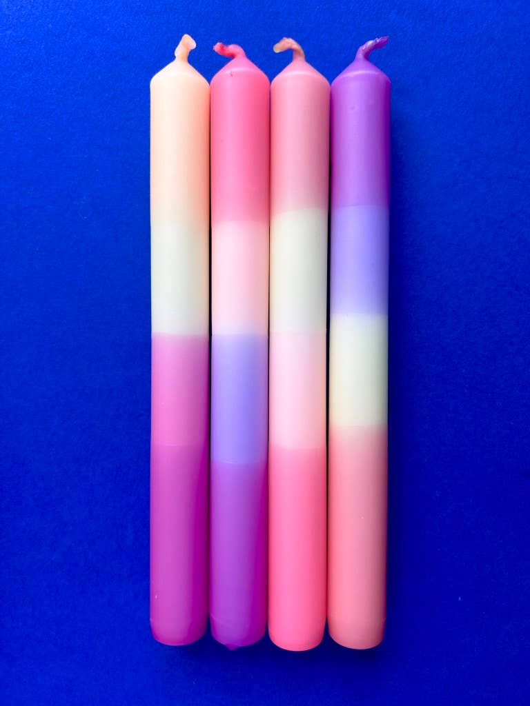 Set of 4 table candles. pastel colours of lemon yellow, peach, lilac and apricot.