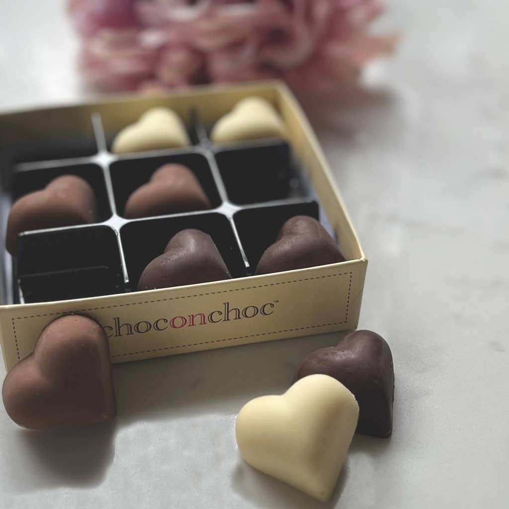 Handmade Belgium Chocolate hearts in milk, white and dark chocolate.
