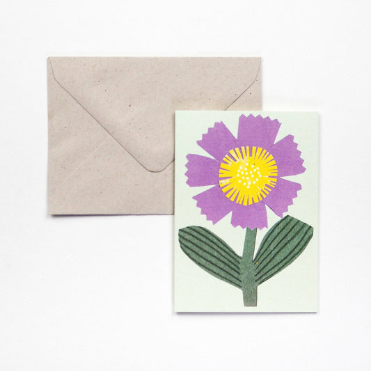 Small Greetings card with a little purple flower. Blank inside.