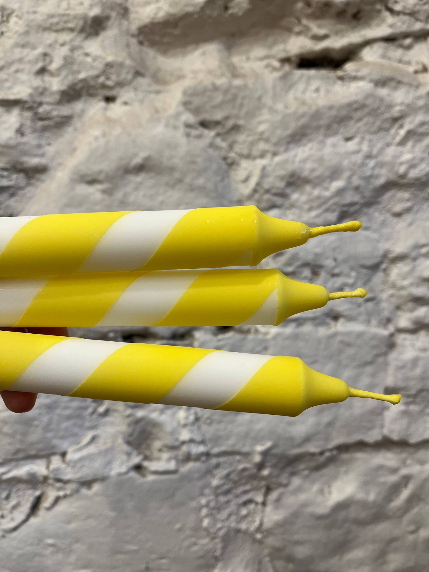 Helter skelter yellow and white spiral dinner candles.