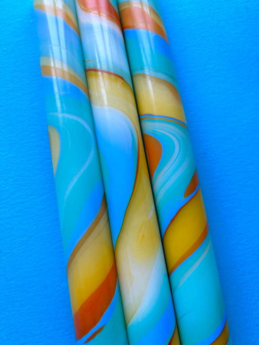 marbled dinner candles, blues and yellows.