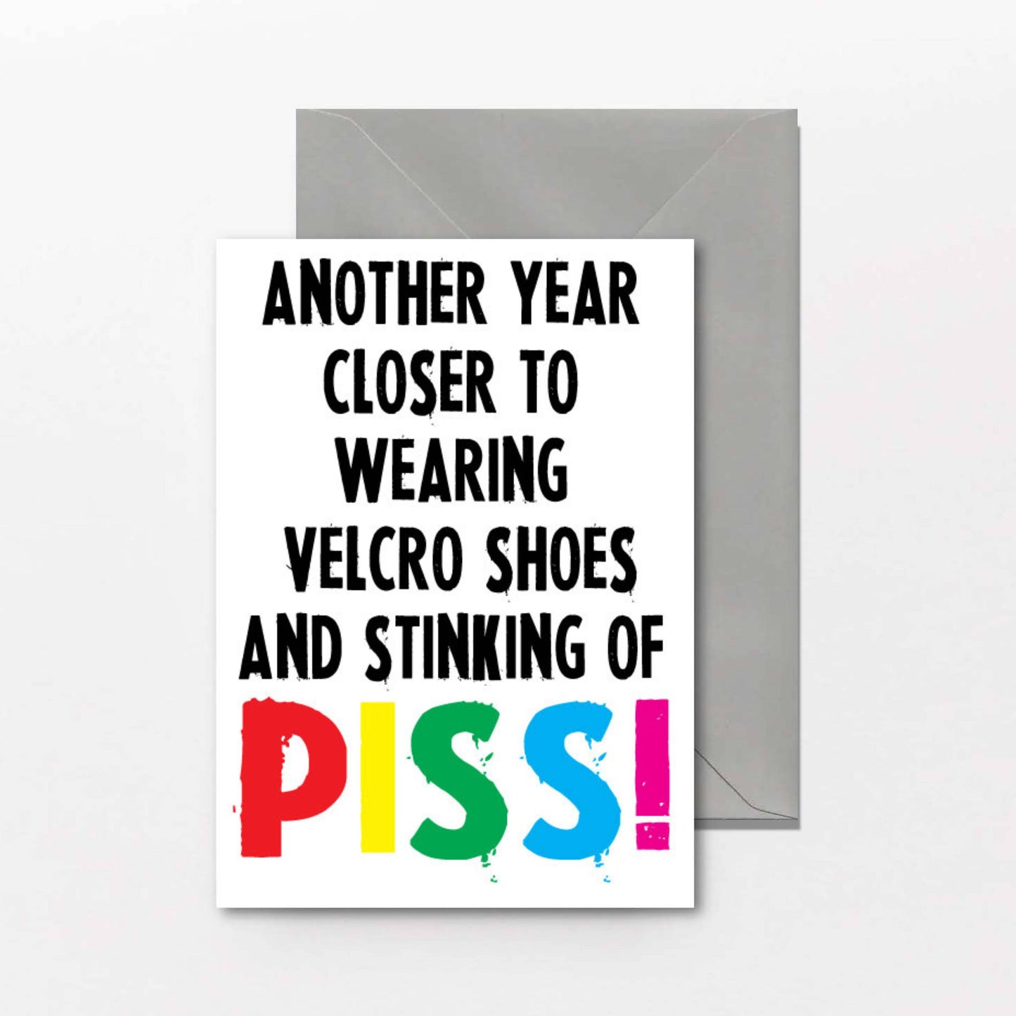 Greeting card with humorous text and colorful letters on a white background