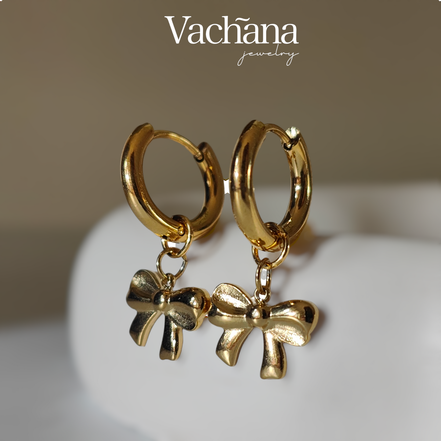 Gold plated hoop with bow charm