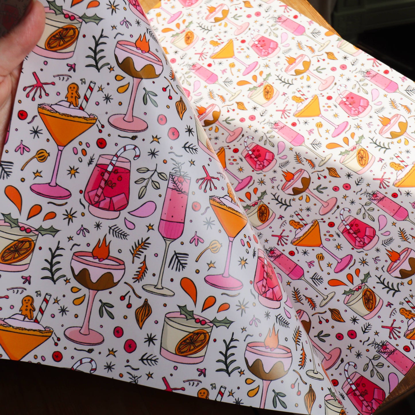 Patterned fabric with cocktail and dessert designs on a white background