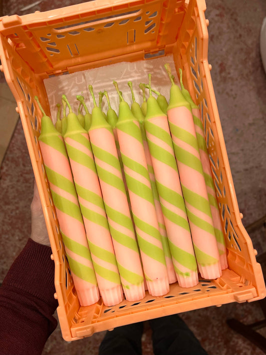Tapered Candles with halter skelter design in peach and sage green.
