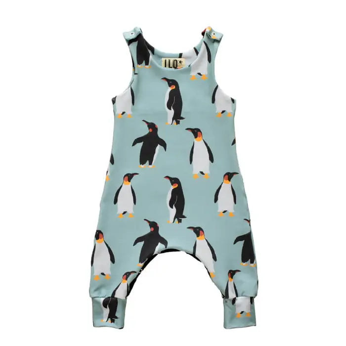 Grow with me baby romper, with adjustable poppers. Fabric design with a pale blue background and penguins.