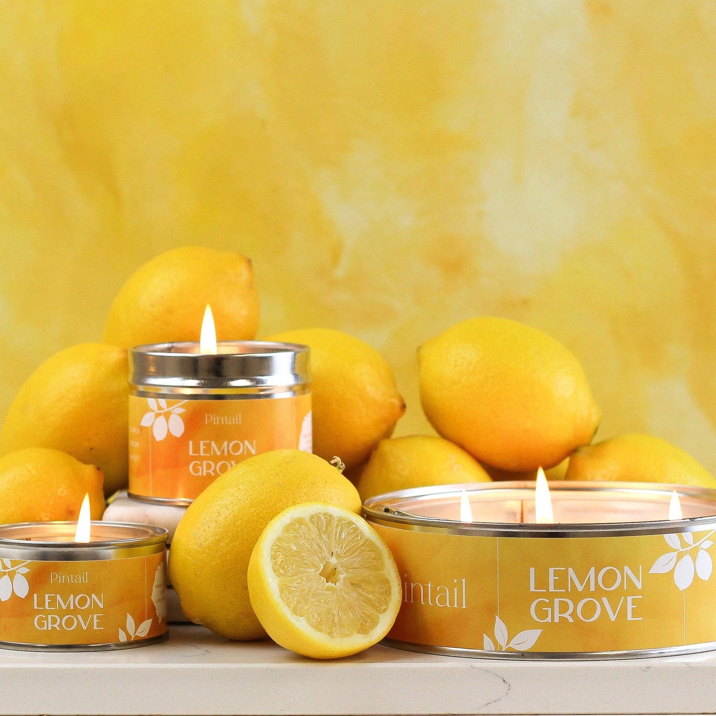 Lemon and poured candle in a small paint pot tin,
