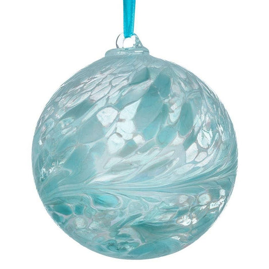 Turquoise glass ornament with marbled pattern on a white background