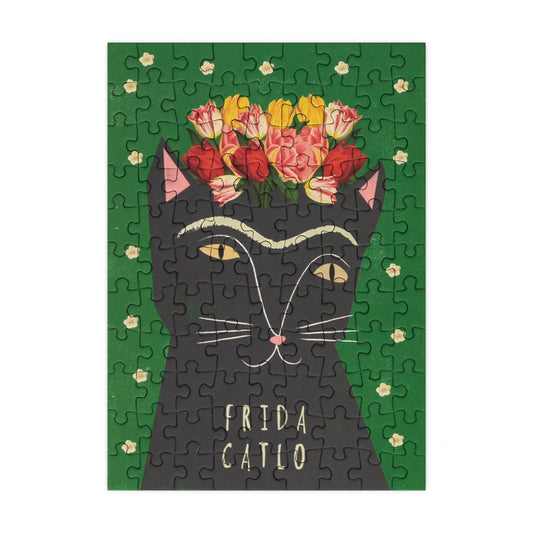 Jigsaw puzzle with a cat design and 'Frida Catlo' text on a green background