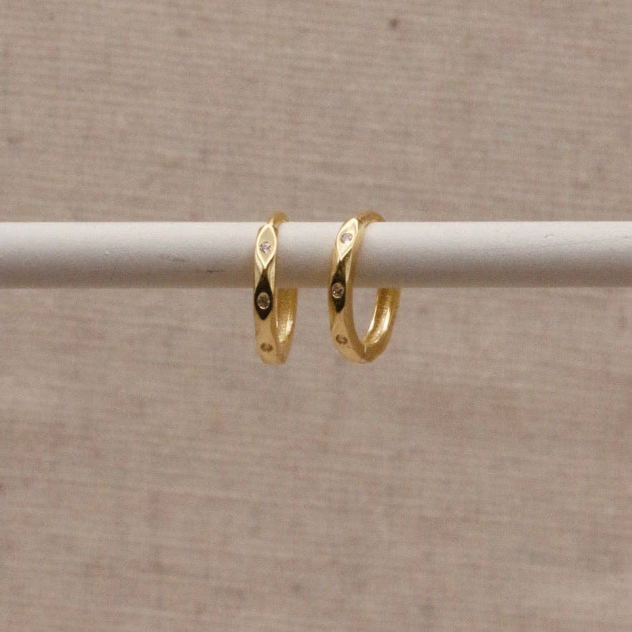 Gold plated huggy earrings with 3 tiny sparkle stones.