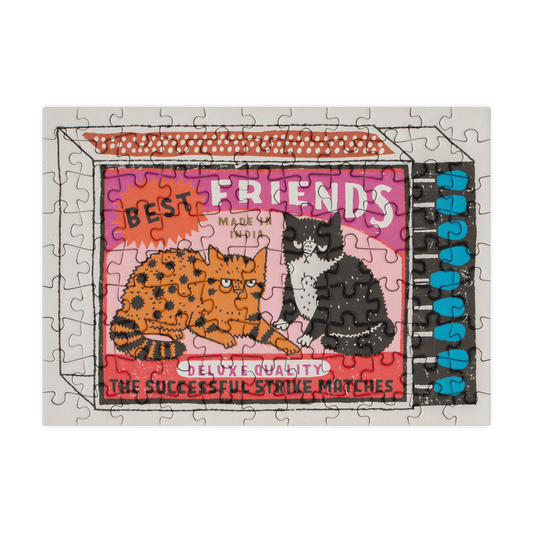 Jigsaw puzzle with two cats and 'Best Friends' text on a white background