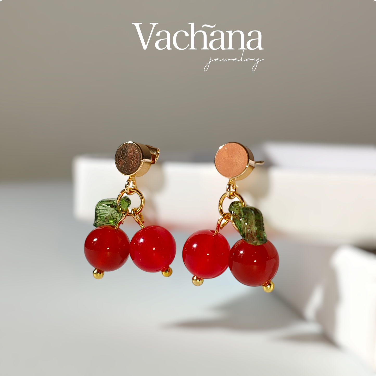 red ruby gem stone on gold plated stud.