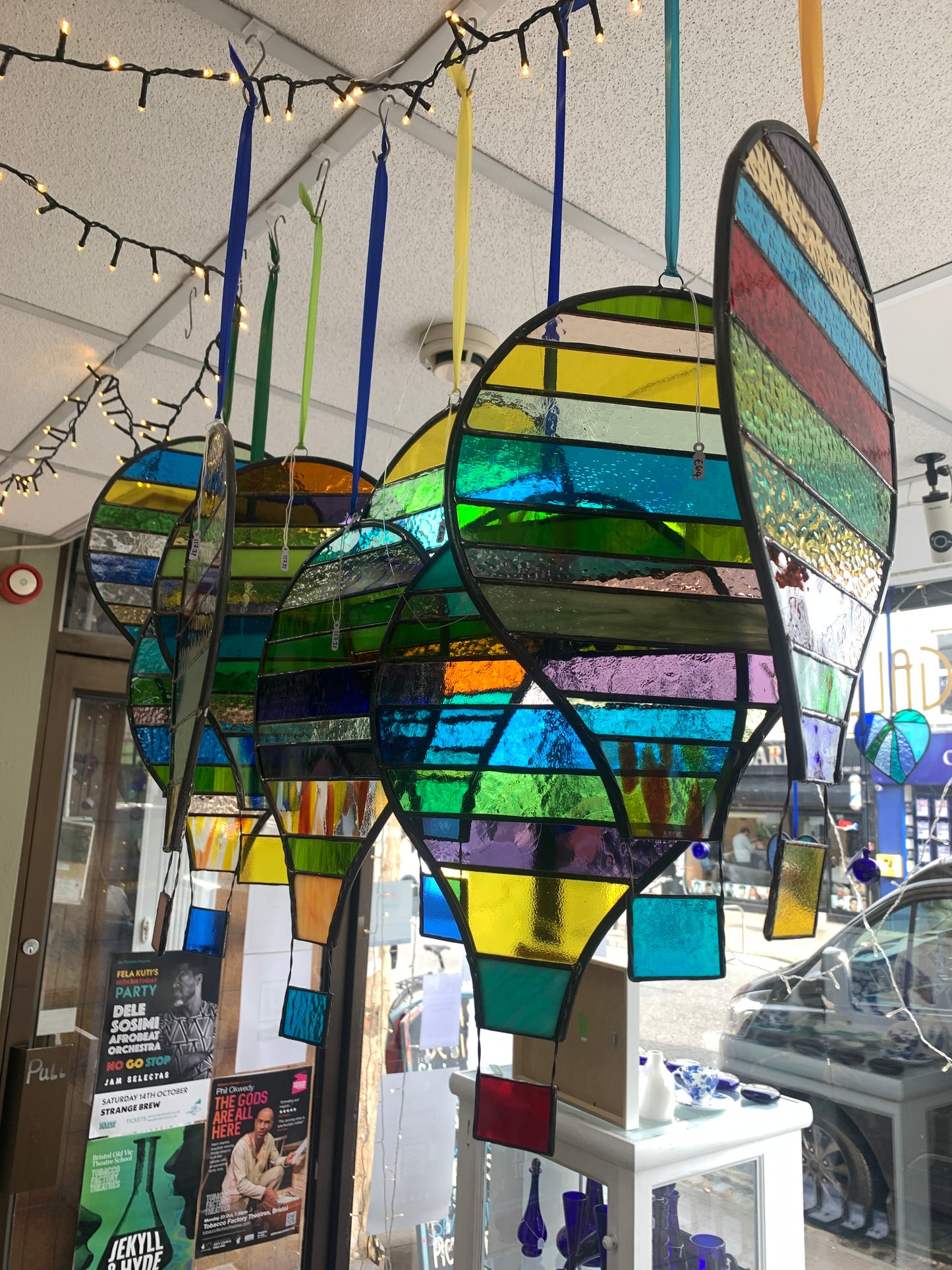 Stained glass hot air balloon suncatcher with stripes.