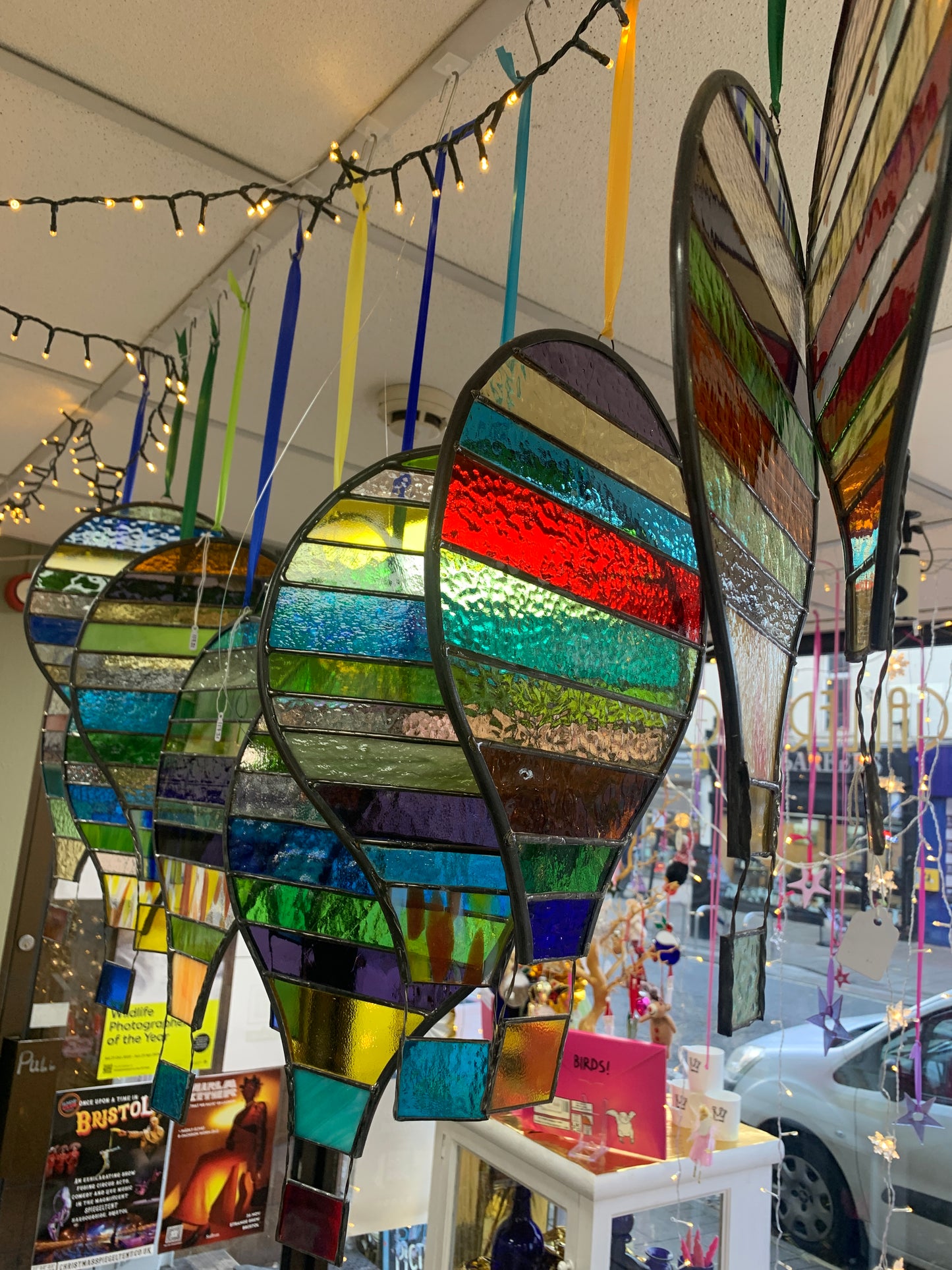 Stained glass hot air balloon suncatcher with stripes.