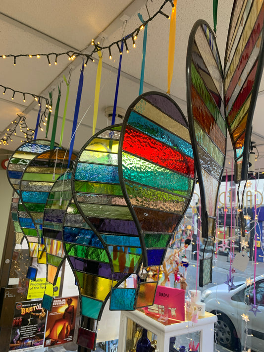 Stained glass hot air balloon suncatcher with stripes.