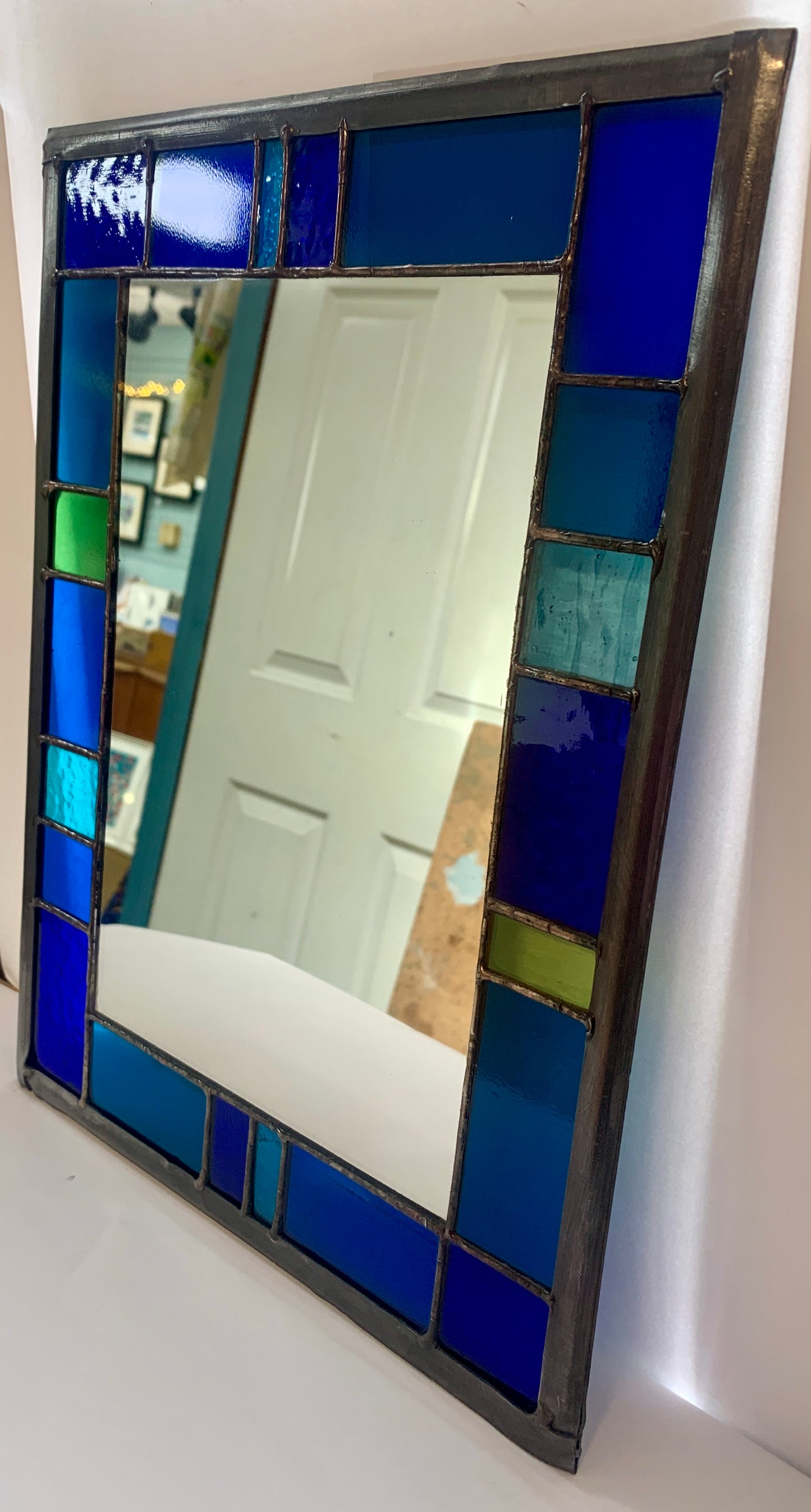 Stained Glass Mirror Stained Glass Mirror with randomly placed blue and green glass border. Stained Glass. Traditional Colour Glass. Blues, Aqua and Turquoise Glass.