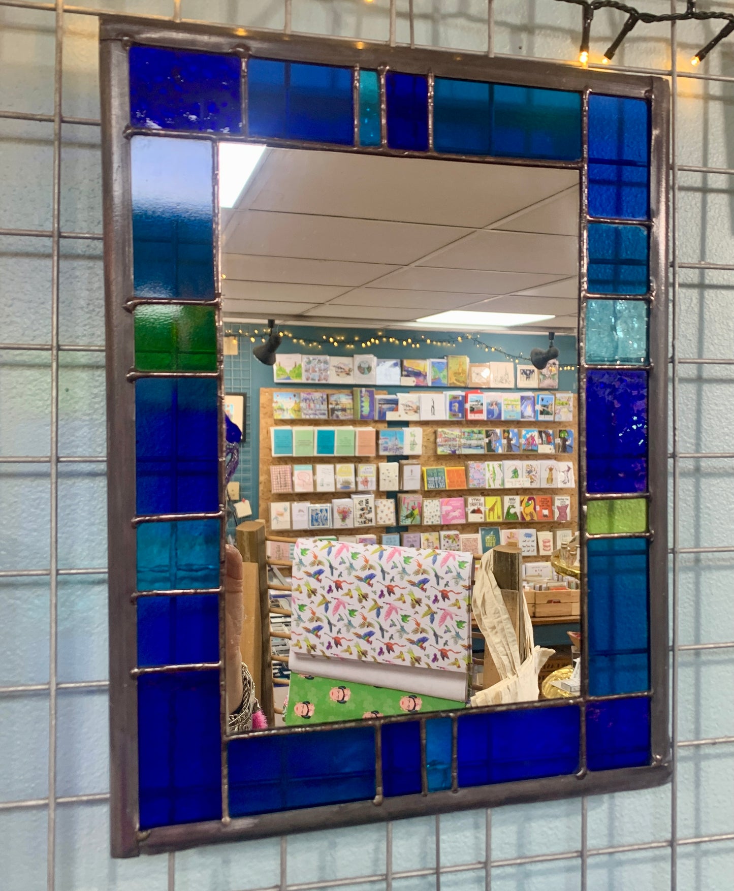 Stained Glass Mirror with randomly placed blue and green glass border.Stained Glass Mirror with randomly placed blue and green glass border. Stained Glass. Traditional Colour Glass. Blues, Aqua and Turquoise Glass.