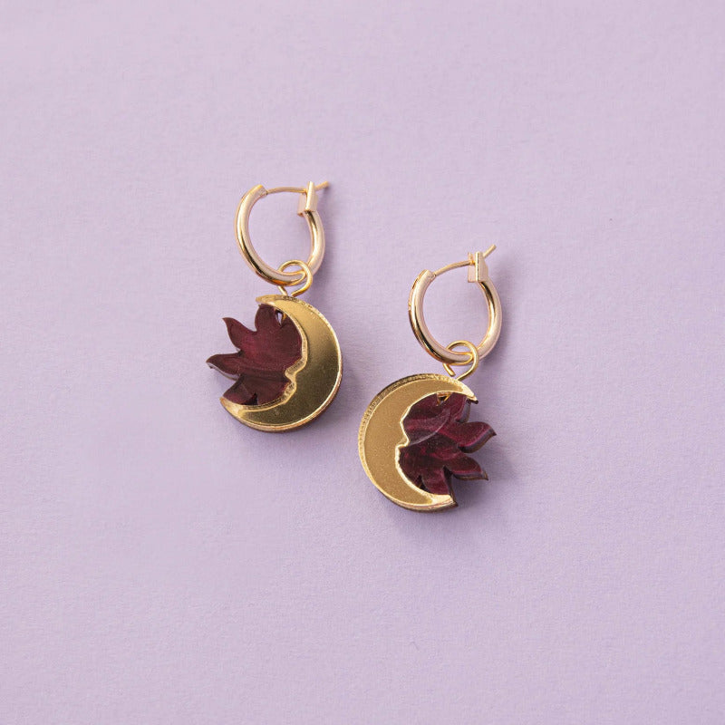 Small gold hoop earrings with gold crescent moon and dark red sun
