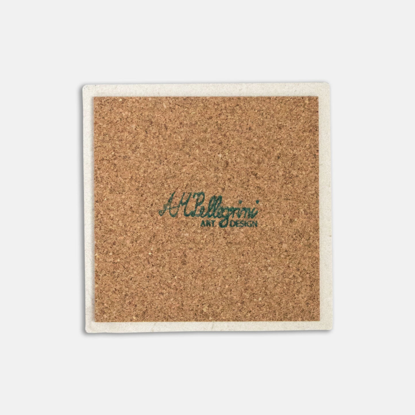 The back of a stone coaster is the central focus of the image. The coaster has a cork backing and the logo "AM Pellegrini Art & Design" is printed in the centre.