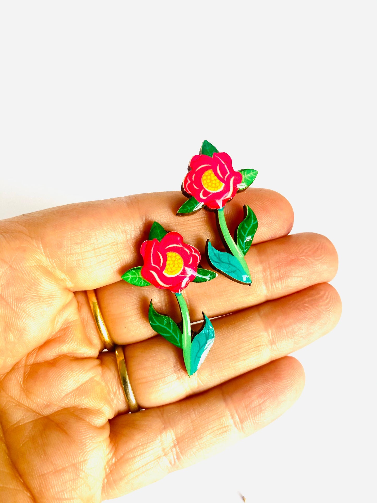 Resin and wooden flower earrings with stem.