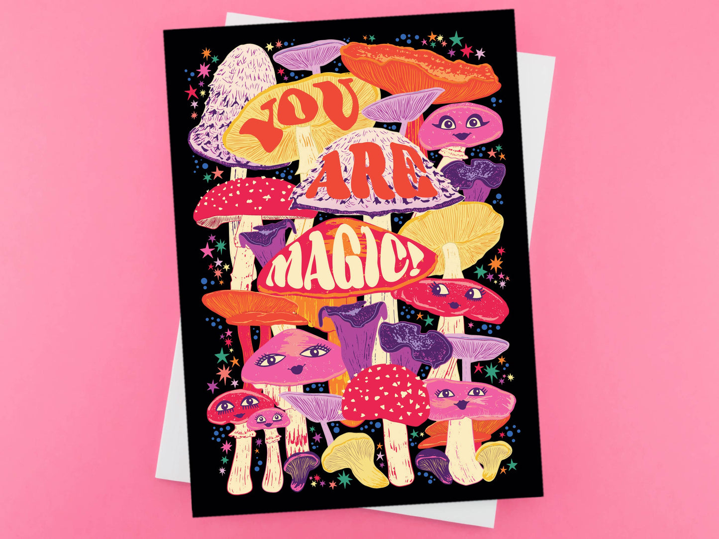 Greetings card. Blank inside. Text ready You are magic. Illustration of colourful mushrooms with eyes.